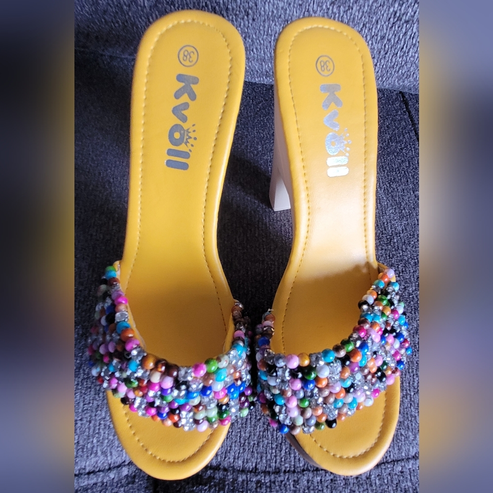 Kvoll yellow heels in size 38.